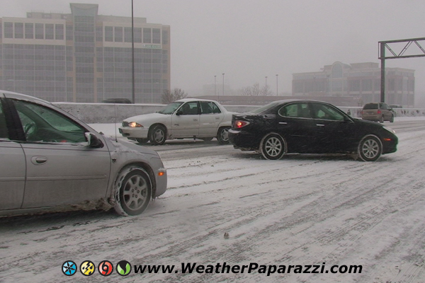 Cars spinning out in a winter storm.